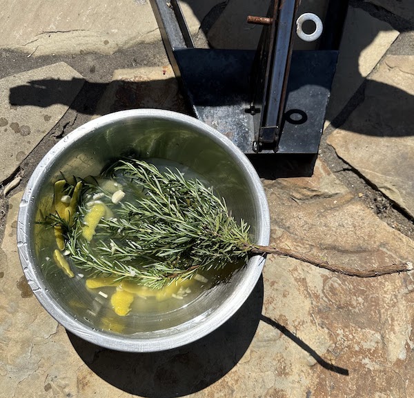 Salmuera, a salty brine, is what gives the meat its unique flavor profile and keeps it juicy through the long cook.